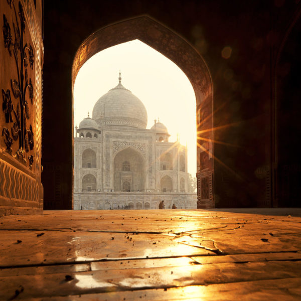 Experience extraordinary sights like this view of the Taj Mahal at sunrise in Agra when you take a tailor-made holiday with Alfred&.